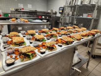 picture showing several sandwiches placed in trays ready to eat